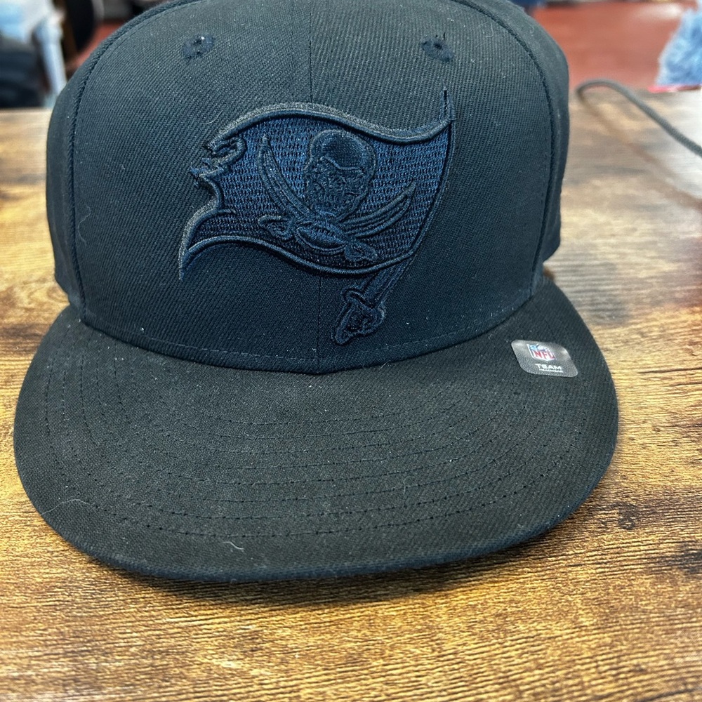 New Era Tampa Bay Buccaneers Black on Black 9FIFTY Snapback Hat.